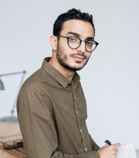 young businessman in casualwear and eyeglasses loo JB4ZZET