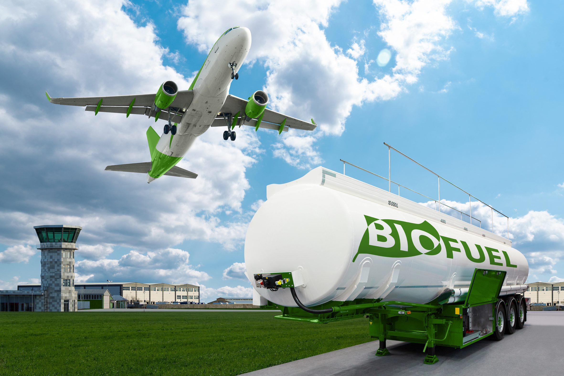 Airplane and bioguel tank trailer on the background of airport. New energy sources